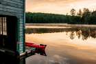 USA, New York. Adirondack Park, Saranac Lake, Hoel Pond, canoe at boathouse dock. Art Print